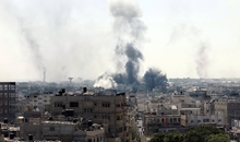 Smoke billows from buildings following an Israeli military strike east of Rafah in the southern Gaza Strip, on August 1, 2014. Israeli shelling killed eight people in southern Gaza, medics said, just hours after a 72-hour humanitarian ceasefire took effect. AFP PHOTO/ SAID KHATIB (Photo credit should read SAID KHATIB/AFP/Getty Images)