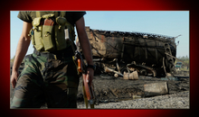 Afghan soldier walks near one of two fuel tankers bombed by NATO airstrike in Kunduz, Afghanistan, 5 September 2009.