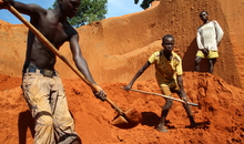 An Amnesty International researcher visited a mine in the Carnot region in May 2015. Children as young as 11 were engaged in mining work instead of attending school. Miners were digging deep into the earth, with no equipment to shore up the pit walls to prevent collapse. They were camping in very tough conditions on site, both to avoid spending time travelling back and forth to their village, and to protect the mine from being looted or taken over. Although they expressed confidence that this site would yield diamonds, they pointed to a nearby site where they had worked for some time, saying that their efforts there had been entirely unsuccessful.