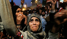 CAIRO, EGYPT - FEBRUARY 11: A woman cries in Tahrir Square after it is announced that Egyptian President Hosni Mubarak was giving up power February 11, 2011 in Cairo, Egypt. After 18 days of widespread protests, Egyptian President Hosni Mubarak, who has now left Cairo for his home in the Egyptian resort town of Sharm el-Sheik, announced that he would step down. (Photo by Chris Hondros/Getty Images)
