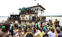 People from the Democratic Republic of Congo arrive on an ATC boat from neighbouring Congo Brazzaville after being forcefully deported, at Ngobila beach, near Kinshasa, on April 29, 2014. Several thousands of Congolese from the Democratic Republic of Congo have been deported from neighbouring Congo Brazzaville as the police there launched an operation to oust illegal migrants. Although the number of those deported stands now at several thousand, local authorities in Congo Brazzaville have talked of ousting up to 40 000 illegal migrants from the country.