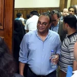 Renowned human rights activist Hossam Bahgat (C) leaves the courtroom in Cairo as an Egyptian court examines a request to issue a travel ban and freeze the assets of him and a fellow rights activist on April 20, 2016. ©MOHAMED EL-SHAHED/AFP via Getty Images)