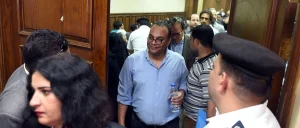 Renowned human rights activist Hossam Bahgat (C) leaves the courtroom in Cairo as an Egyptian court examines a request to issue a travel ban and freeze the assets of him and a fellow rights activist on April 20, 2016. ©MOHAMED EL-SHAHED/AFP via Getty Images)